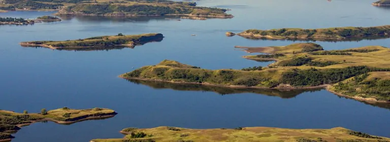 North Dakota State Law Controls Where United States Reacquired Formerly Private Lands; Sovereign Immunity Waived